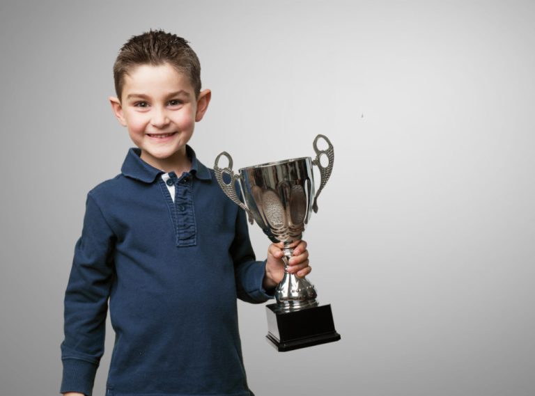 little kid with a trophy